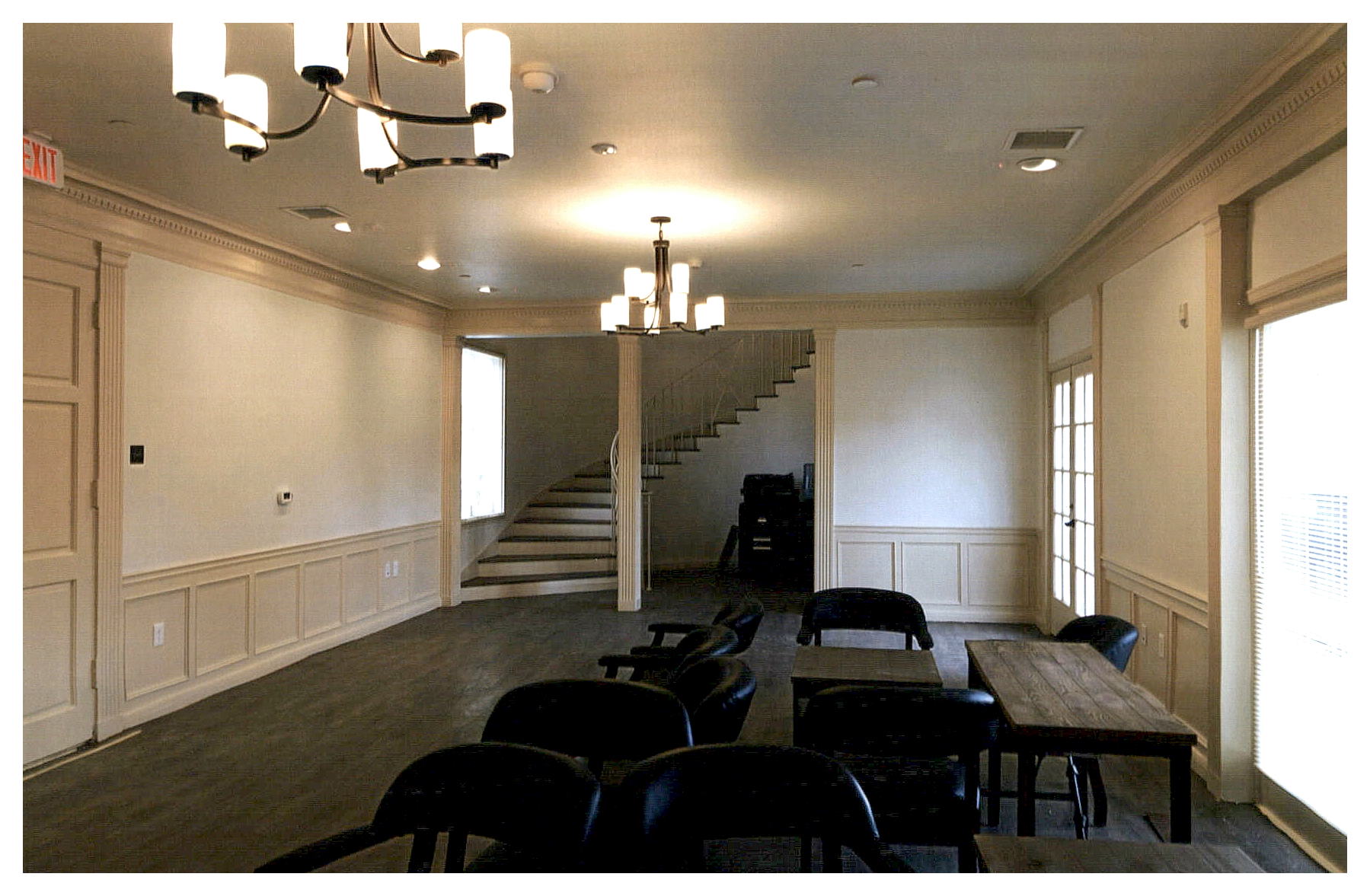 After: interior view of entrance lobby with winding stair visible in back.