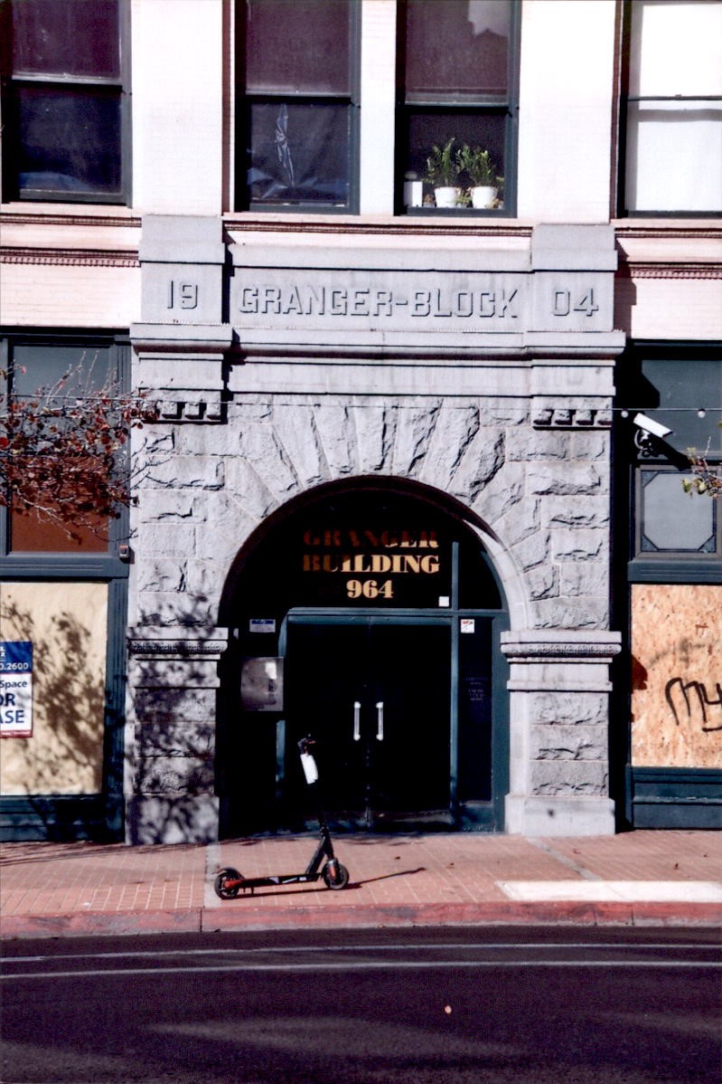 Rusticated store office entry