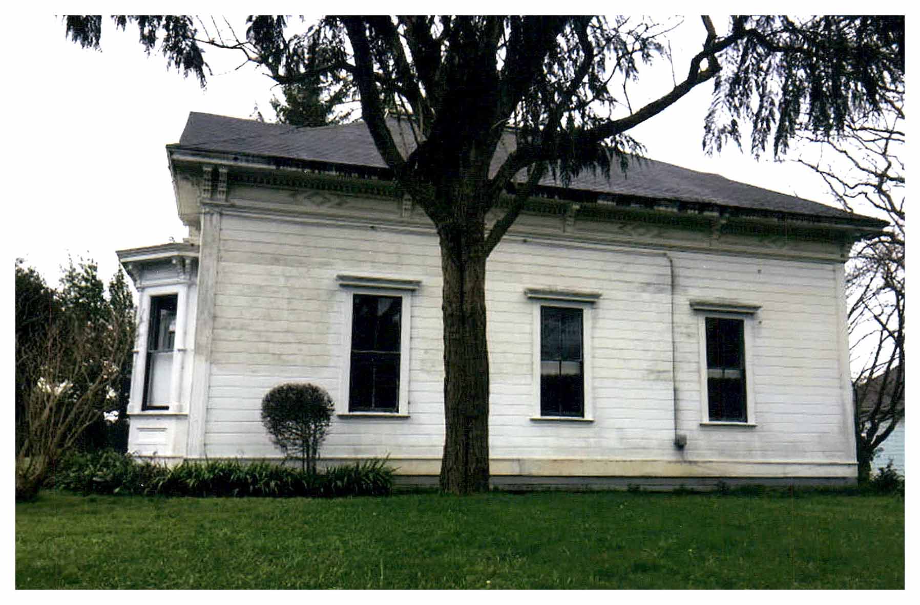 Before: unpainted side facade.