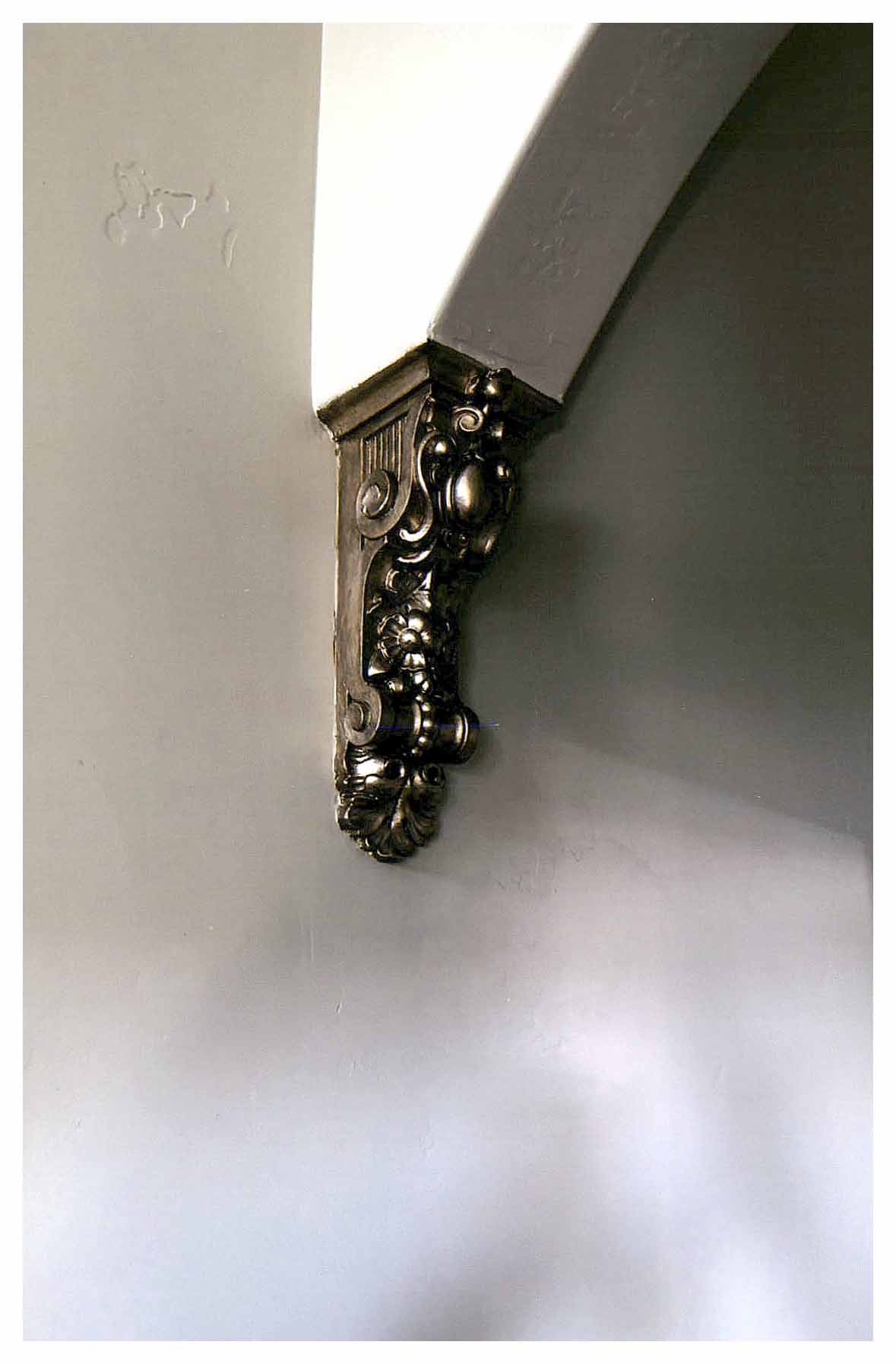 After: detail of repaired arch bracket.