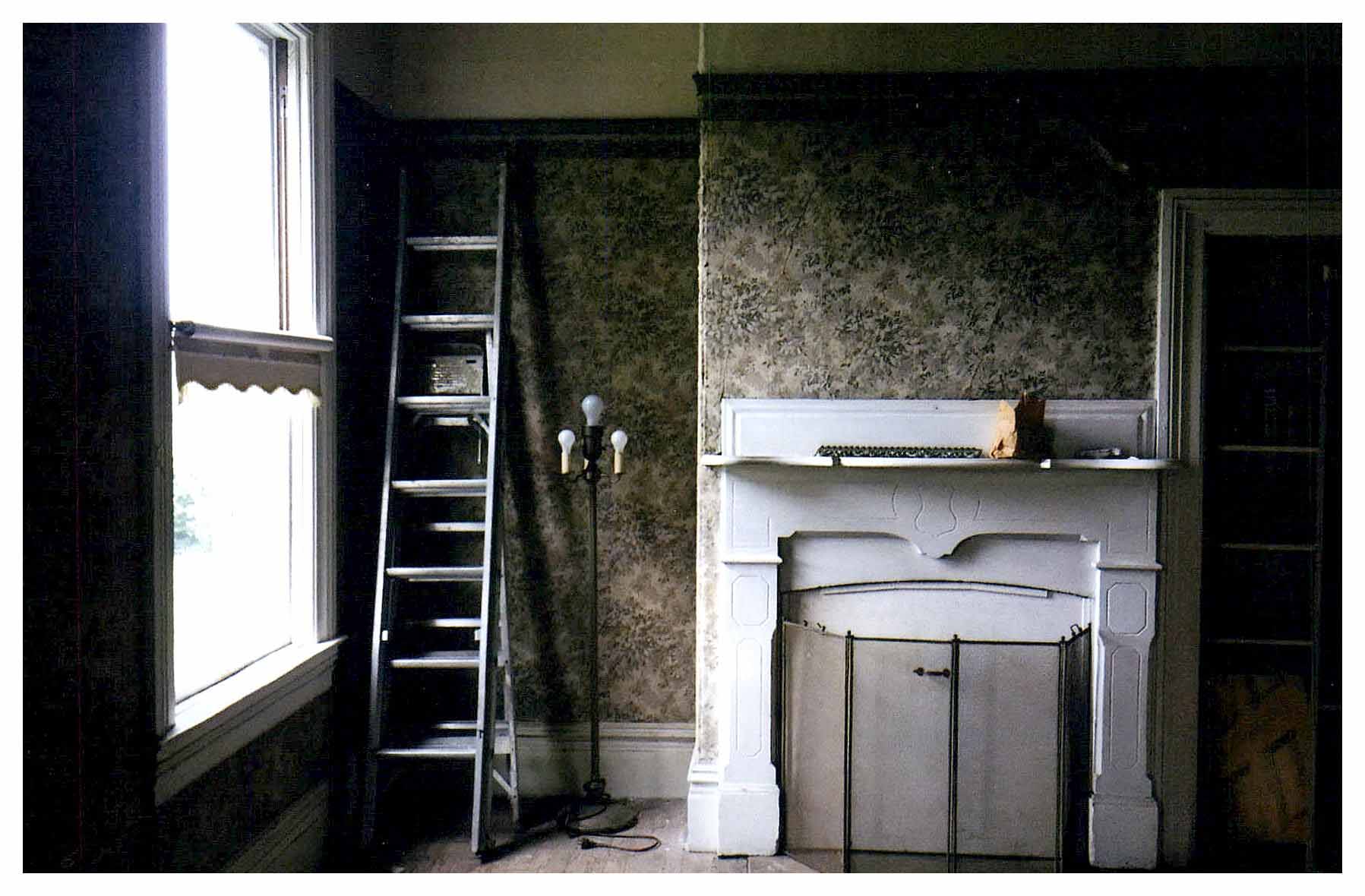 Before: view of fireplace with a recess and a closet on either side.