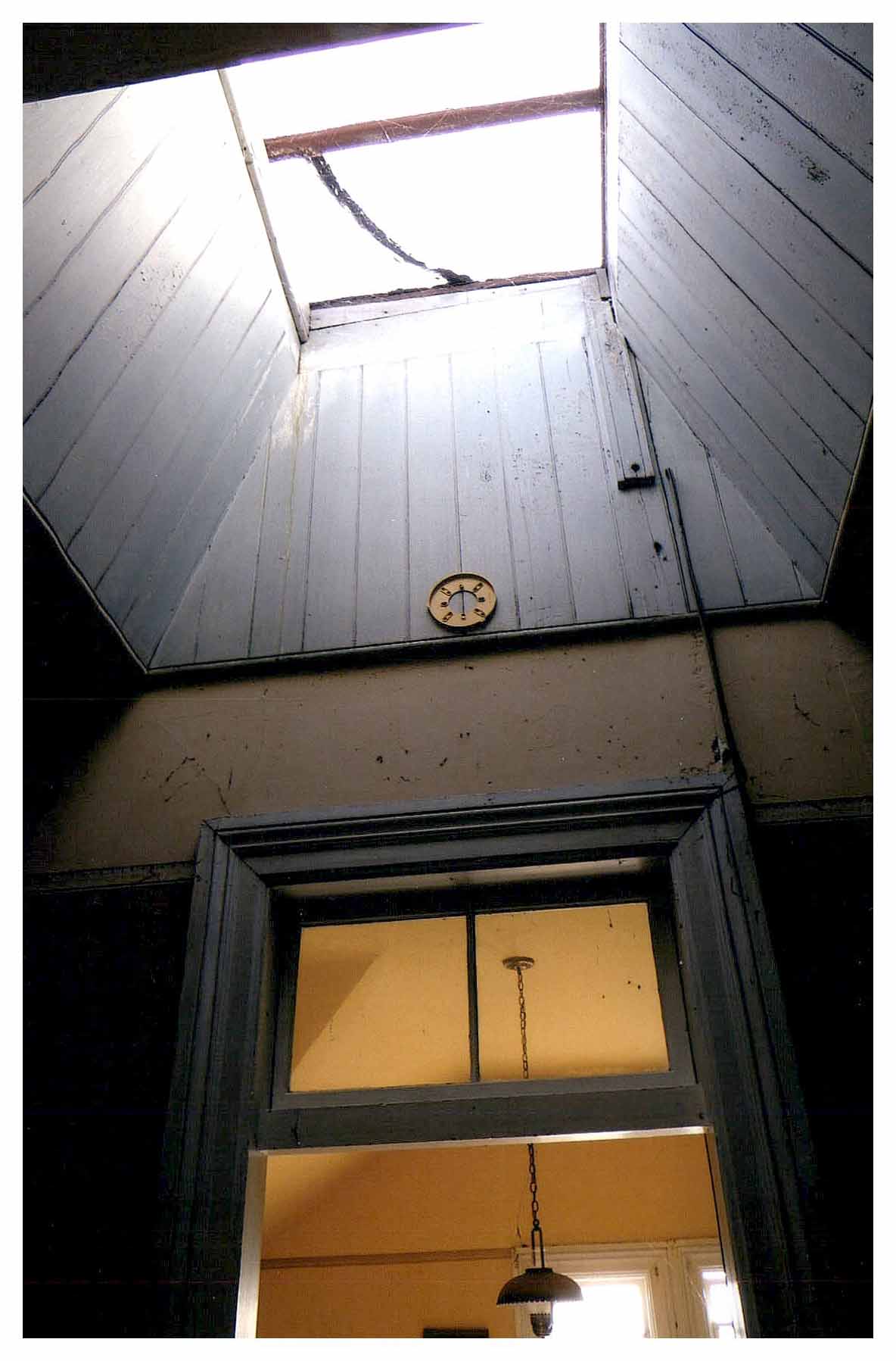 Before: same large skylight view with a deteriorated condition.