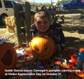 Isaiah Garcia enjoys pumpking caring event