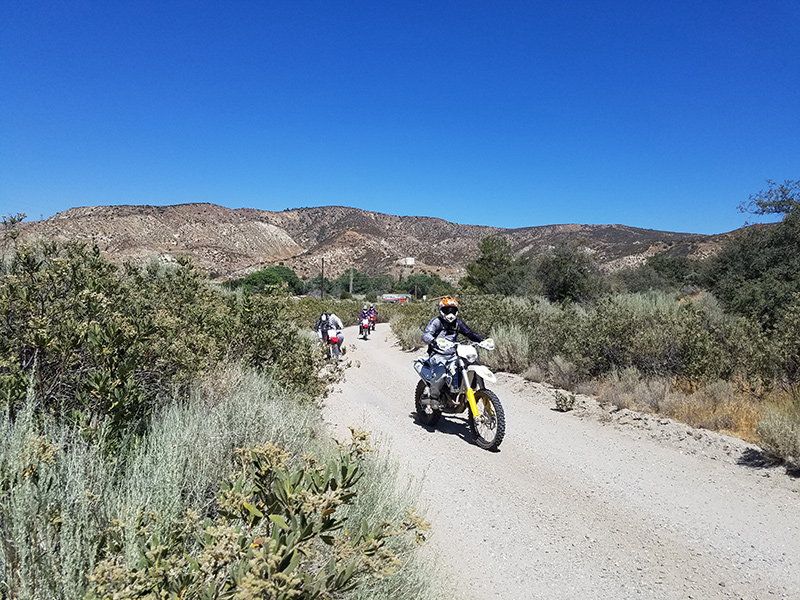Group of people riding OHV motorcycles