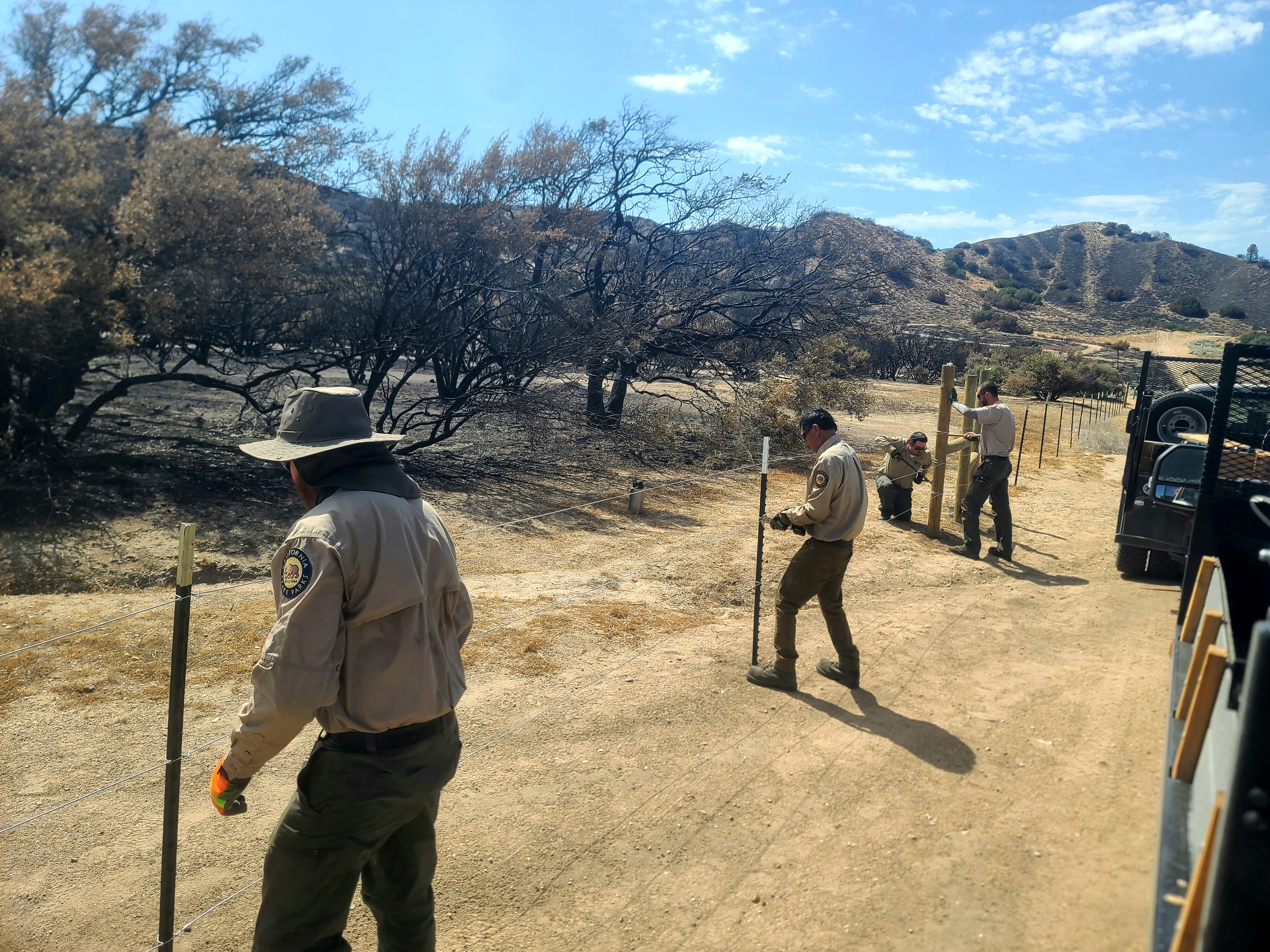 Hungry Valley SVRA trail crew replacing fencing that burned in the Post Fire.