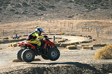 Red mini quad jumping.