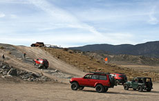 Jeeps and Landcruisers climbing hill