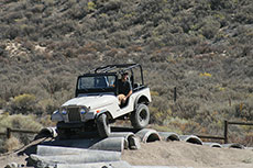 Old jeep on obstacle