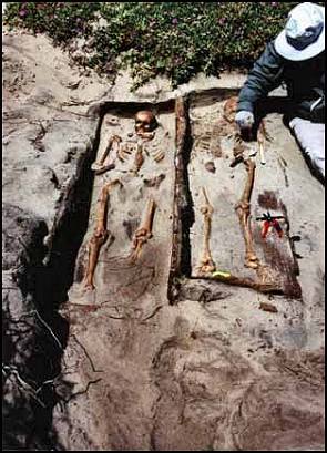 Peter Schulz next to the exposed human remains