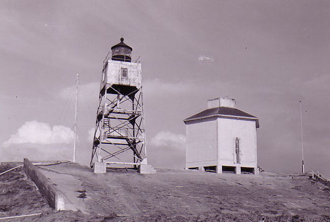 Steel light tower adjacent to tank house, circa late 1940's