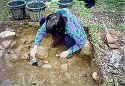 Patricia Petersen excavating unit near the location of the apothecary store.