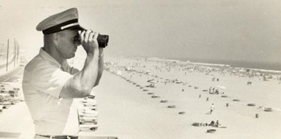 Robert Isenor surveys the beach from the Huntington Headquarter, 1950's 
