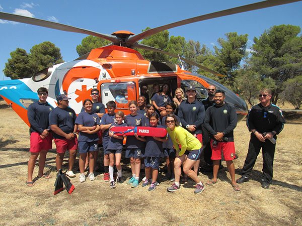 2022 Junior Lifeguards Group Image with Emergency Helicopter
