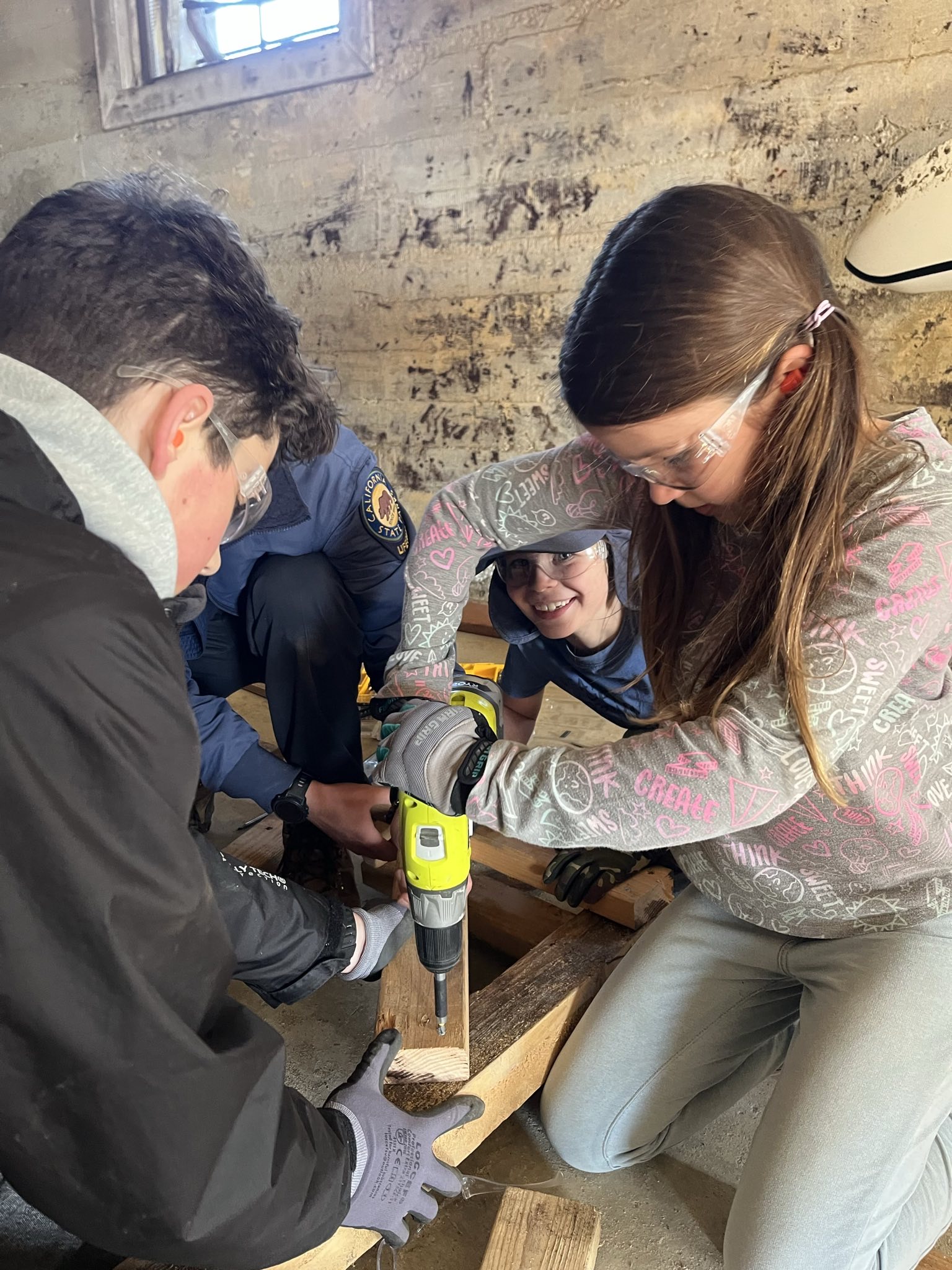 Junior Lifeguards performing carpentry.