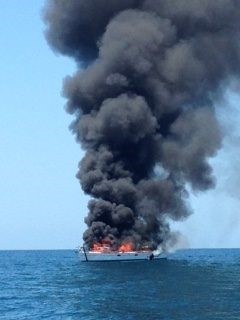 Boat burning on the water