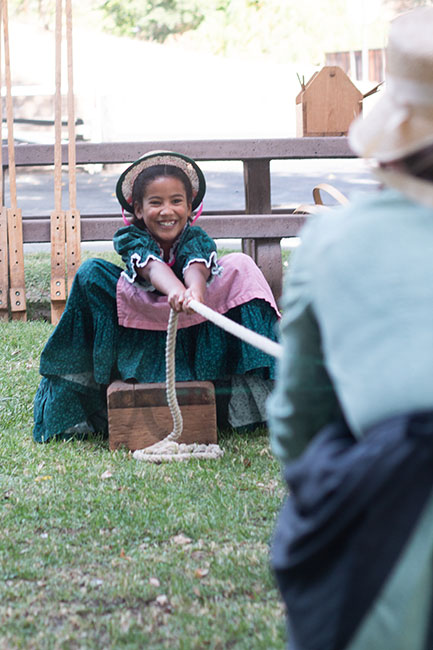 Girl tugging on rope