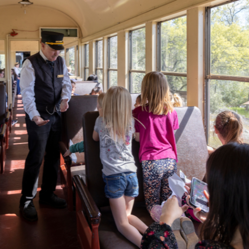 Volunteer talking to children. 