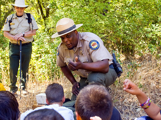 Two State Parks staff leading an interpretive program