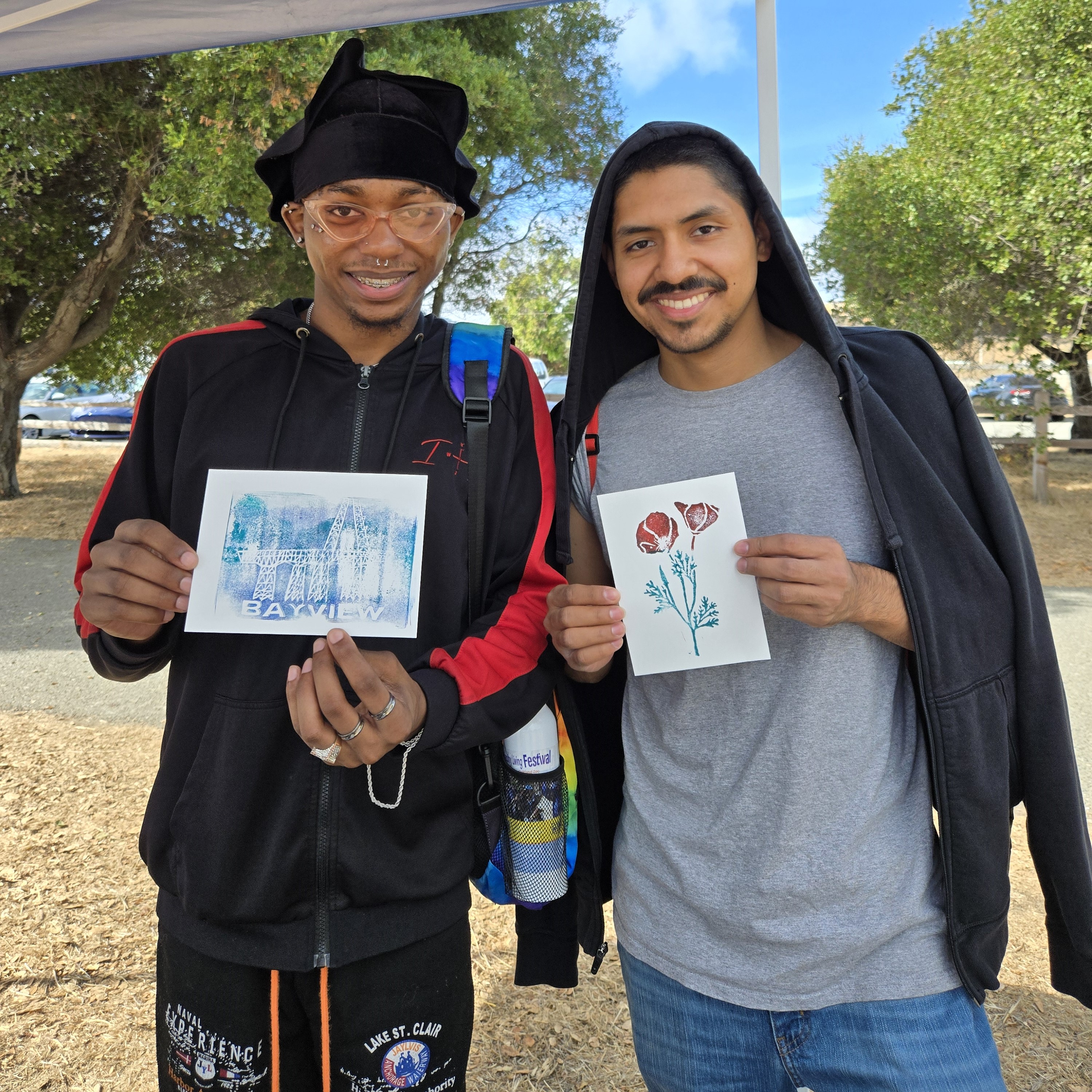 young men with stamp art they made