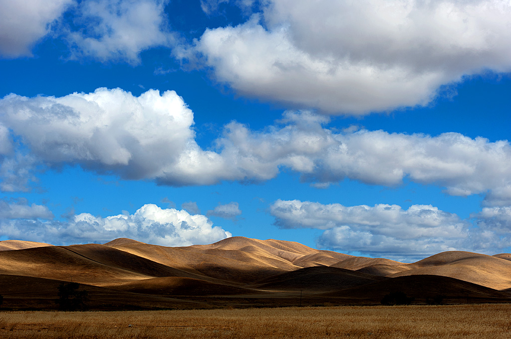 hills and blue sky with clouds