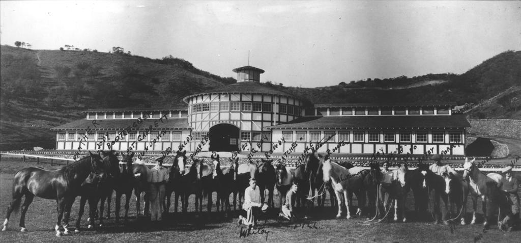 Will Rogers and his horses in front of his stable, circa 1933.