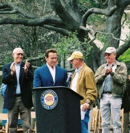 Chuck Rogers presenting Governor Schwarzenegger with deed to Will Rogers SHP. (Photo by Marc Holmes)