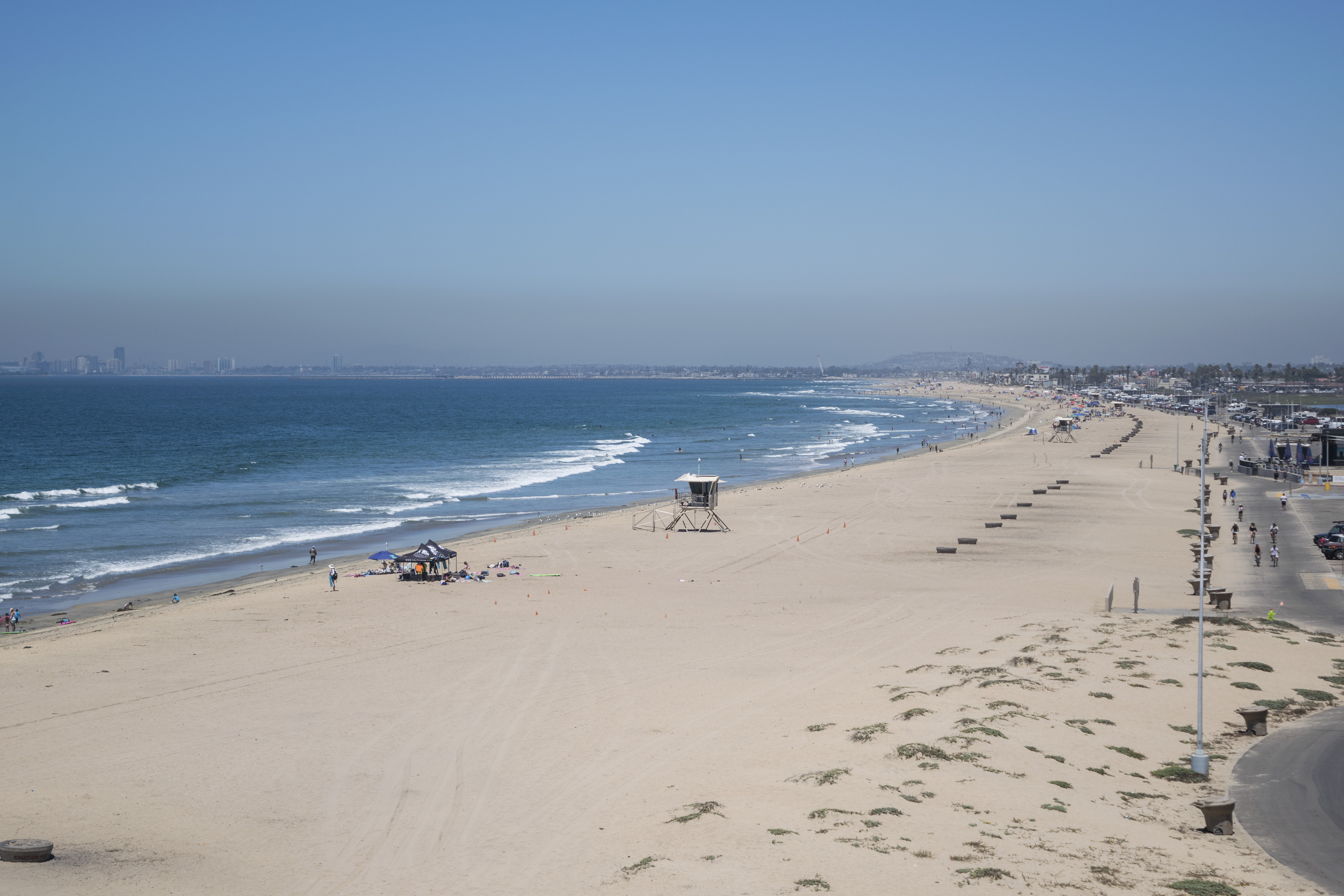 Aerial view of beach with a tower and lifeguard truck