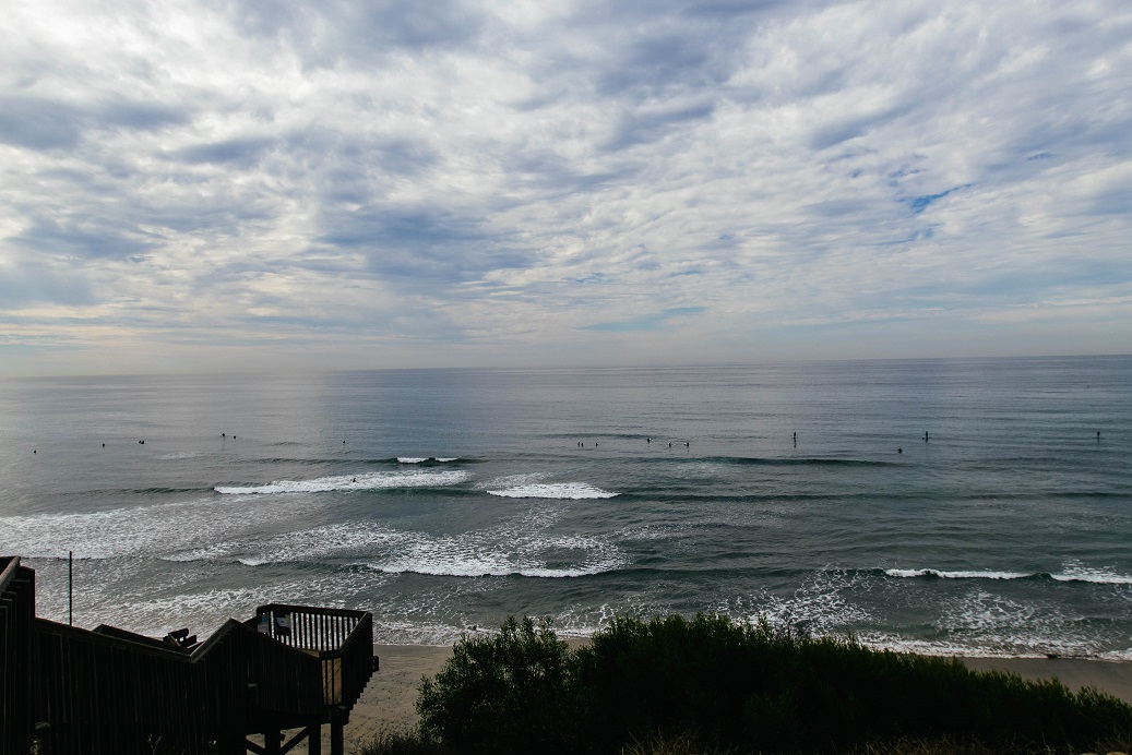 Photo of San Elijo State Beach looking out at the ocean from the area at the top of the stairs down to the beach