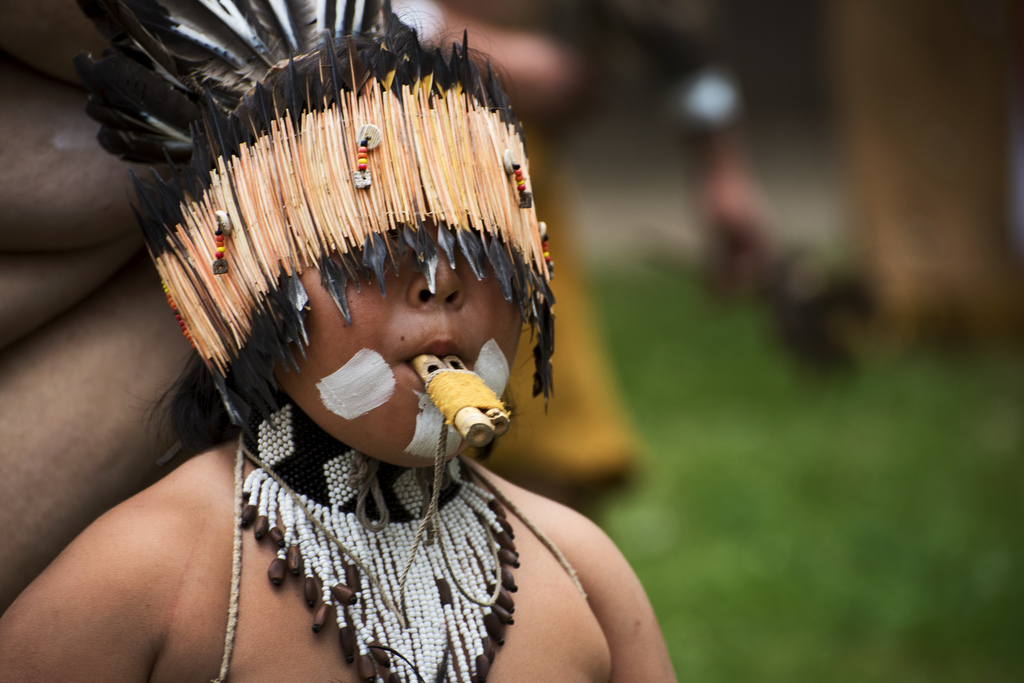 Child with wooden instrument