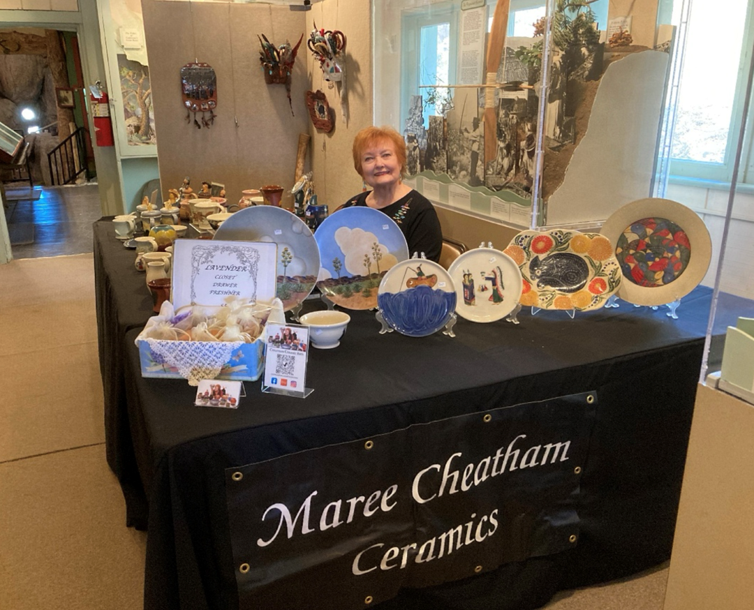 Artist Maree Cheatham with her award-winning ceramic creations. Photo from California State Parks.