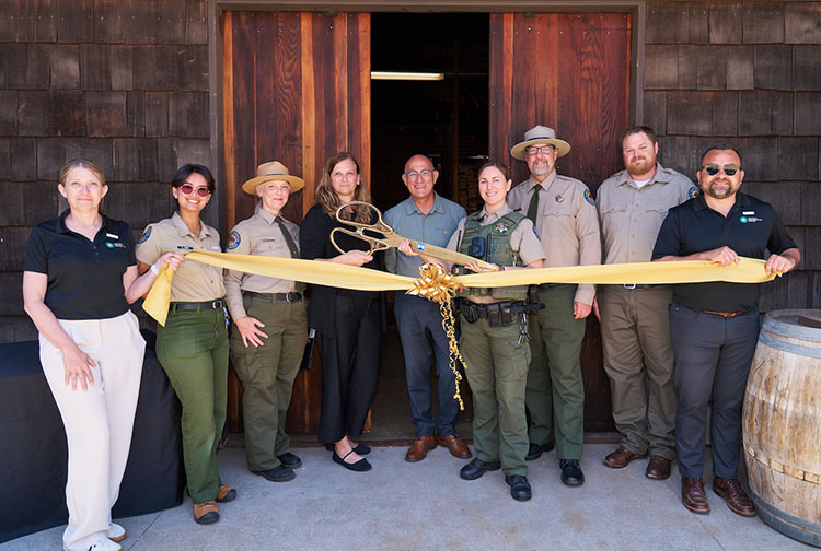 California State Parks and Aramark Destinations staff celebrate the grand opening of the Asilomar Historic Preservation Center. Photo from California State Parks