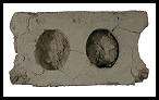 The only remaining concrete block from Frank Milner's barbershop recovered during excavation.